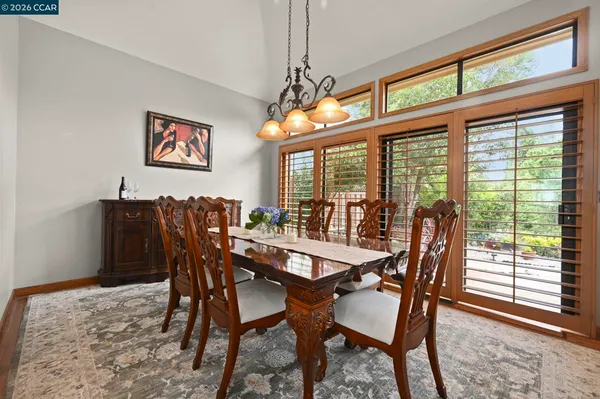 a view of a dining room with furniture window and outside view