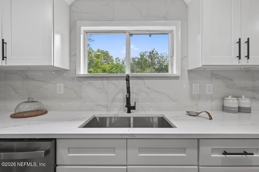 43739 Ratliff Road Callahan, FL 32011 - Photo 26 of 55 a kitchen with a sink and cabinets
