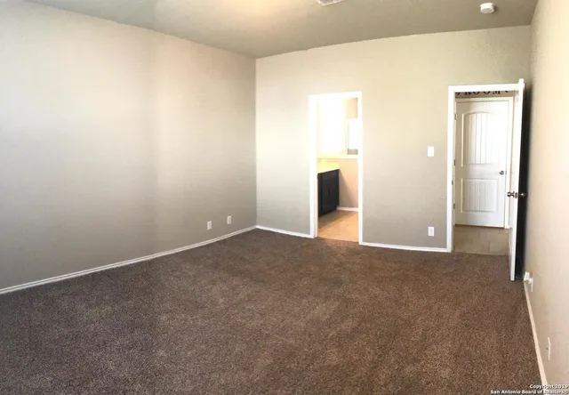 a bathroom with a tub a sink and a shower
