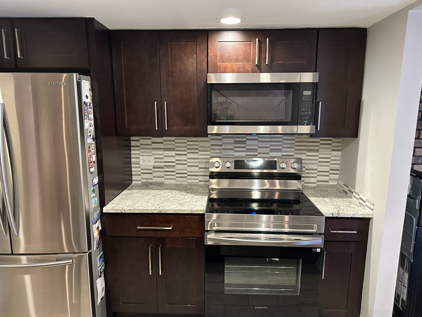 9830 Sayre Avenue, Unit 13 Chicago Ridge, IL 60415 - Photo 8 of 34 a kitchen with a stove and a microwave