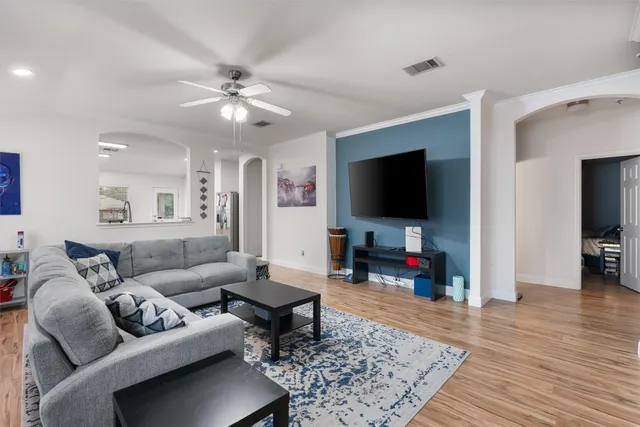 a living room with furniture and a flat screen tv