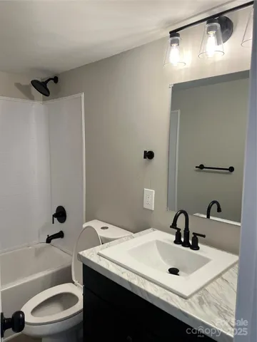 a bathroom with a sink toilet tub and shower