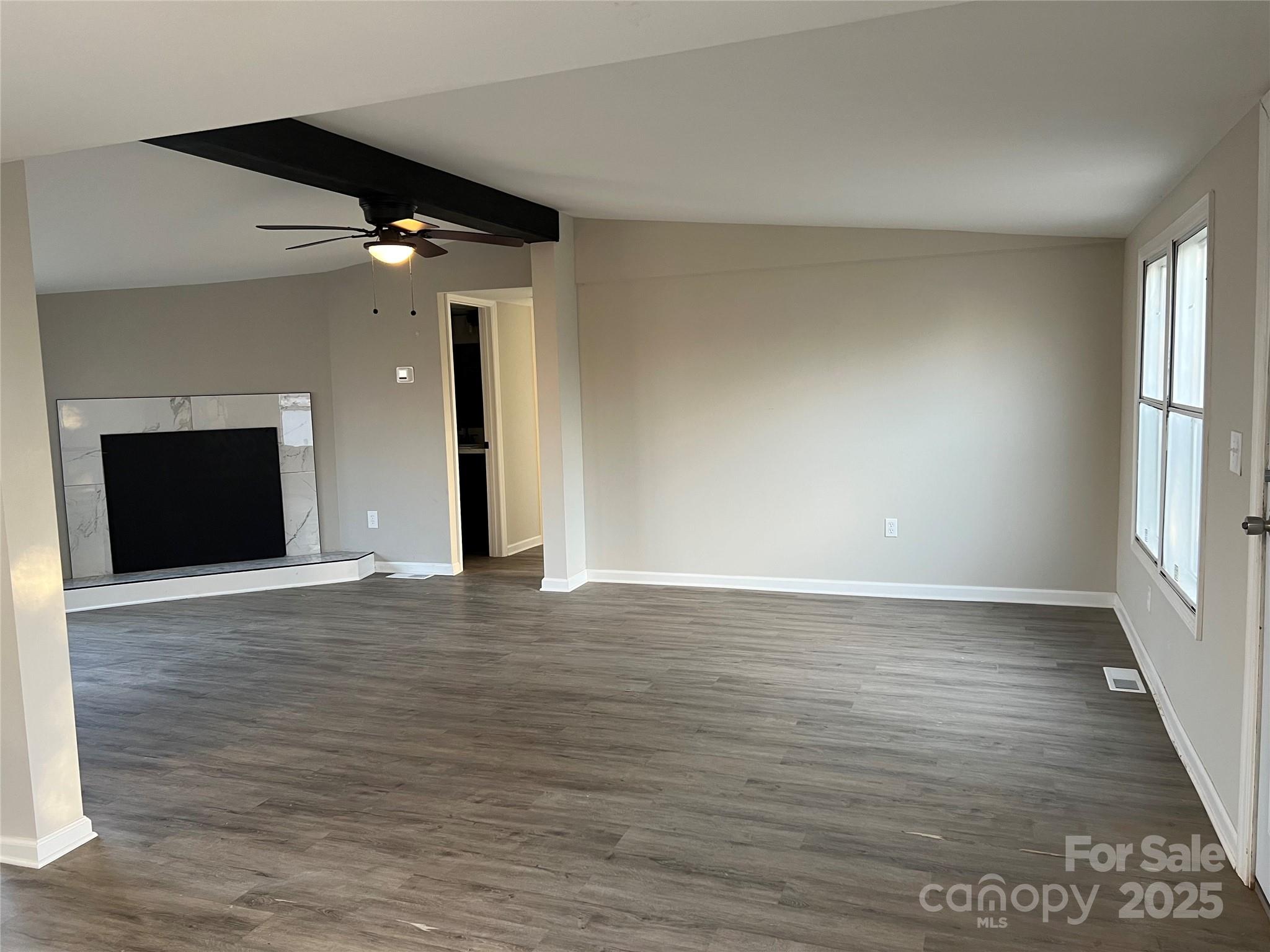1879 Gaynell Street Conover, NC 28613 - Photo 6 of 20 wooden floor in an empty room with a window