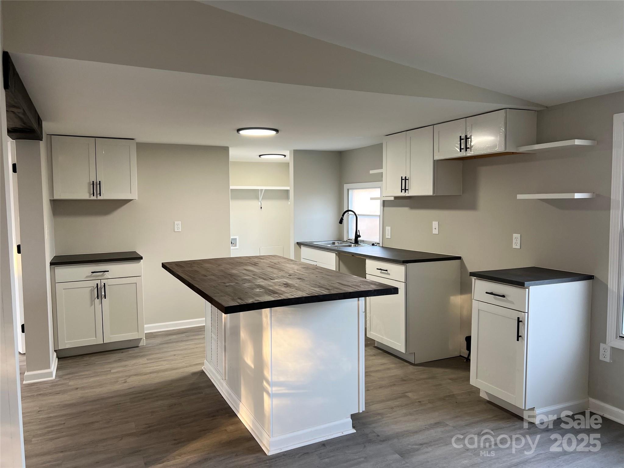 1879 Gaynell Street Conover, NC 28613 - Photo 8 of 20 a kitchen with stainless steel appliances granite countertop a sink stove and refrigerator