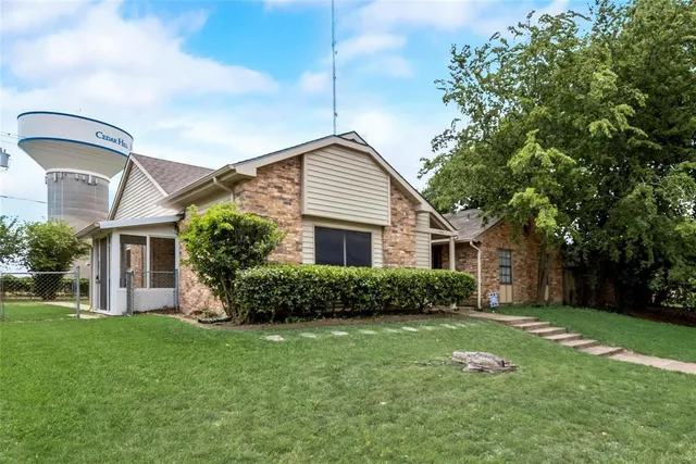 a front view of a house with a yard