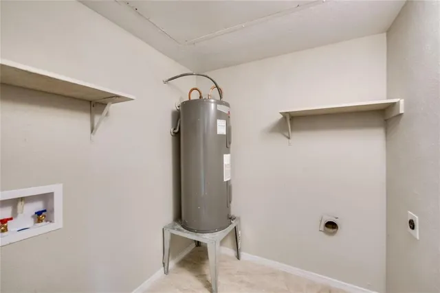 a room with a walk in closet and a mirror