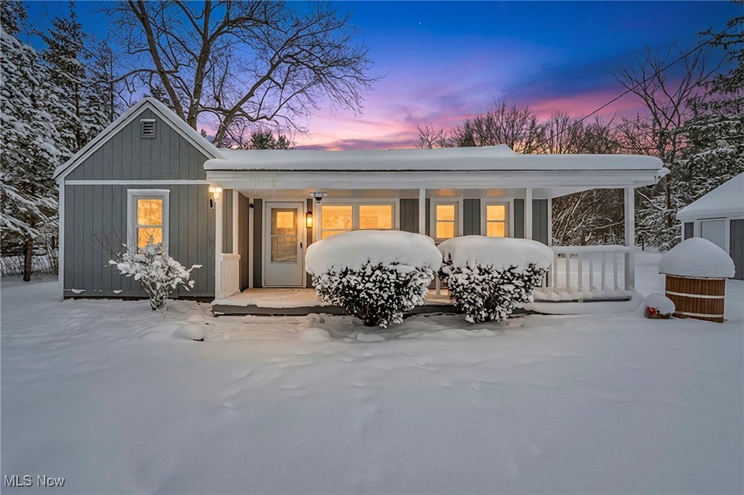 8564 Cedar Road Chesterland, OH 44026 - Photo 42 of 43 Snow covered property with covered porch and board and batten siding