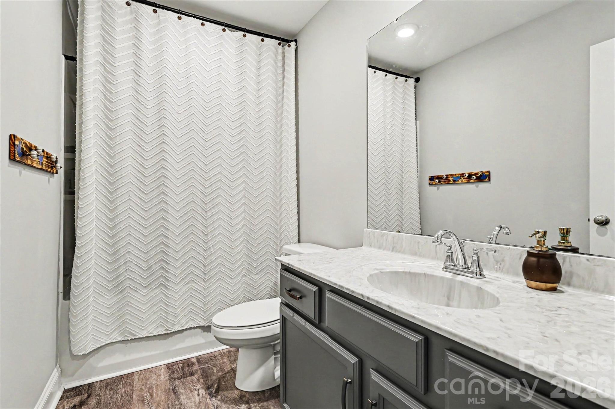 3401 State Rd S-46-76 Sharon, SC 29742 - Photo 23 of 44 a bathroom with a granite countertop sink a toilet and a mirror