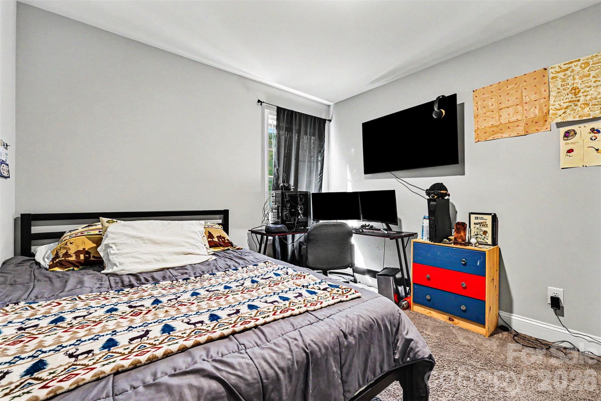 3401 State Rd S-46-76 Sharon, SC 29742 - Photo 27 of 44 a bedroom with a bed and flat screen tv