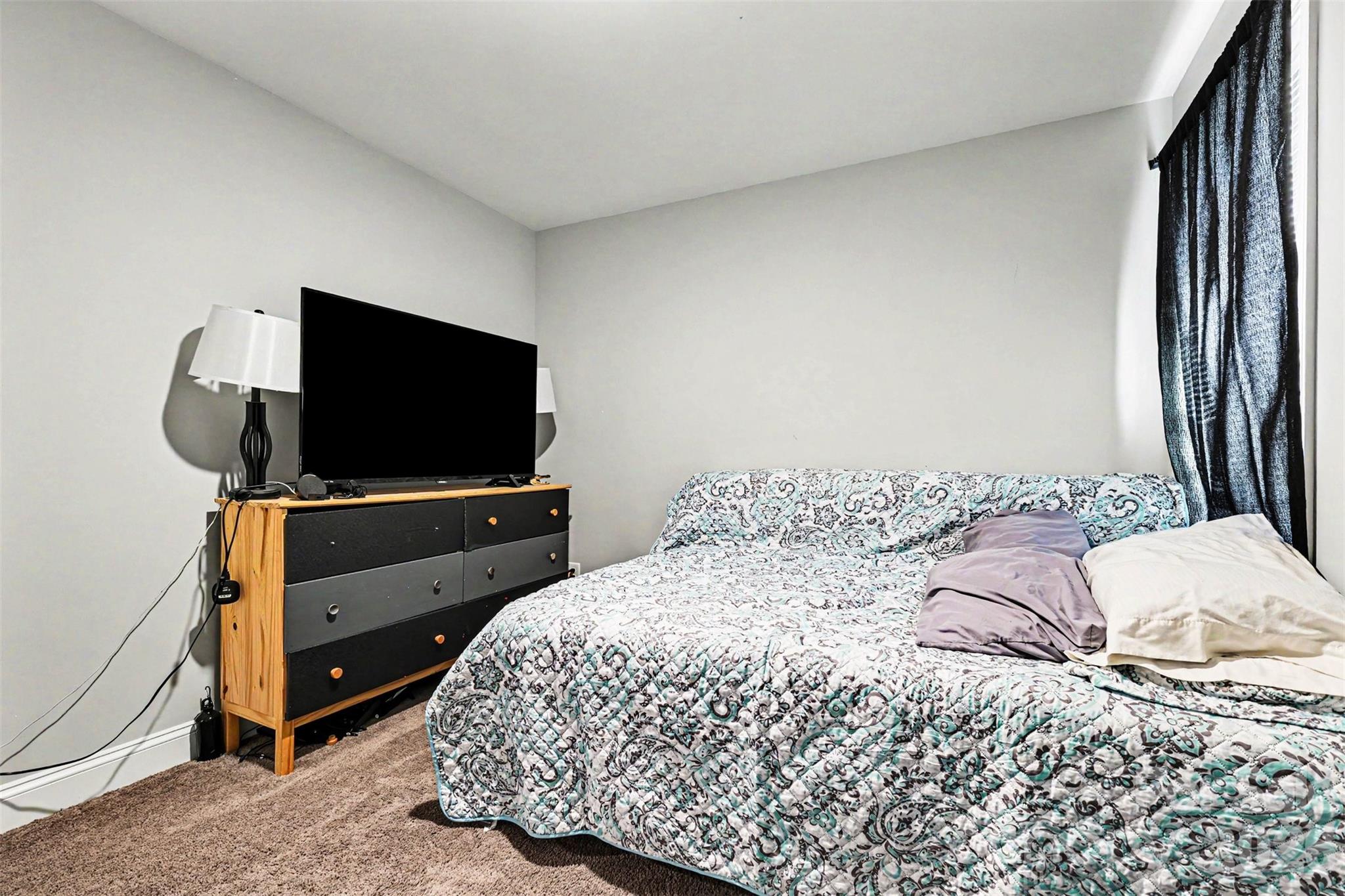3401 State Rd S-46-76 Sharon, SC 29742 - Photo 29 of 44 a bedroom with a bed and a flat screen tv
