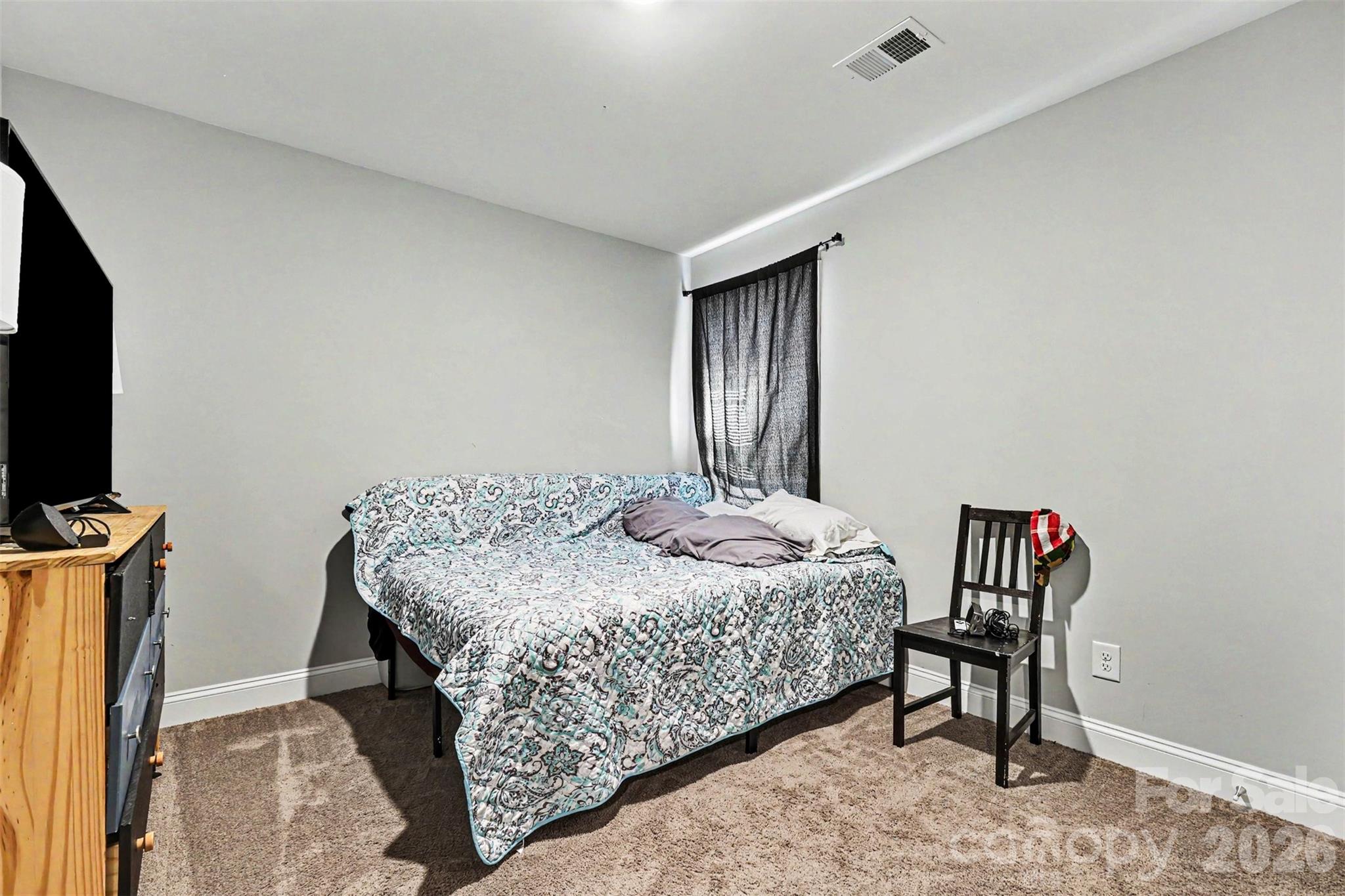 3401 State Rd S-46-76 Sharon, SC 29742 - Photo 30 of 44 a bedroom with a bed and a television in it