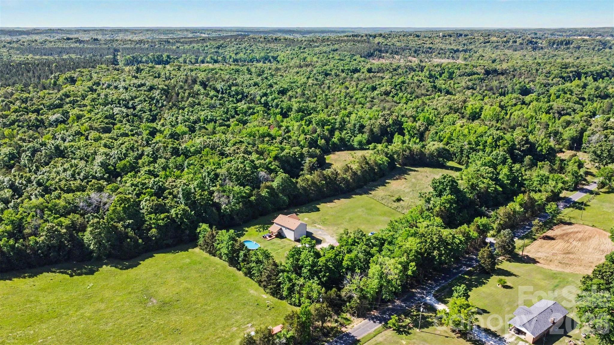 3401 State Rd S-46-76 Sharon, SC 29742 - Photo 40 of 44 a view of a lush green forest with a lake