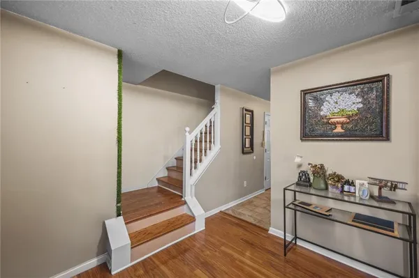a view of an entryway with wooden floor