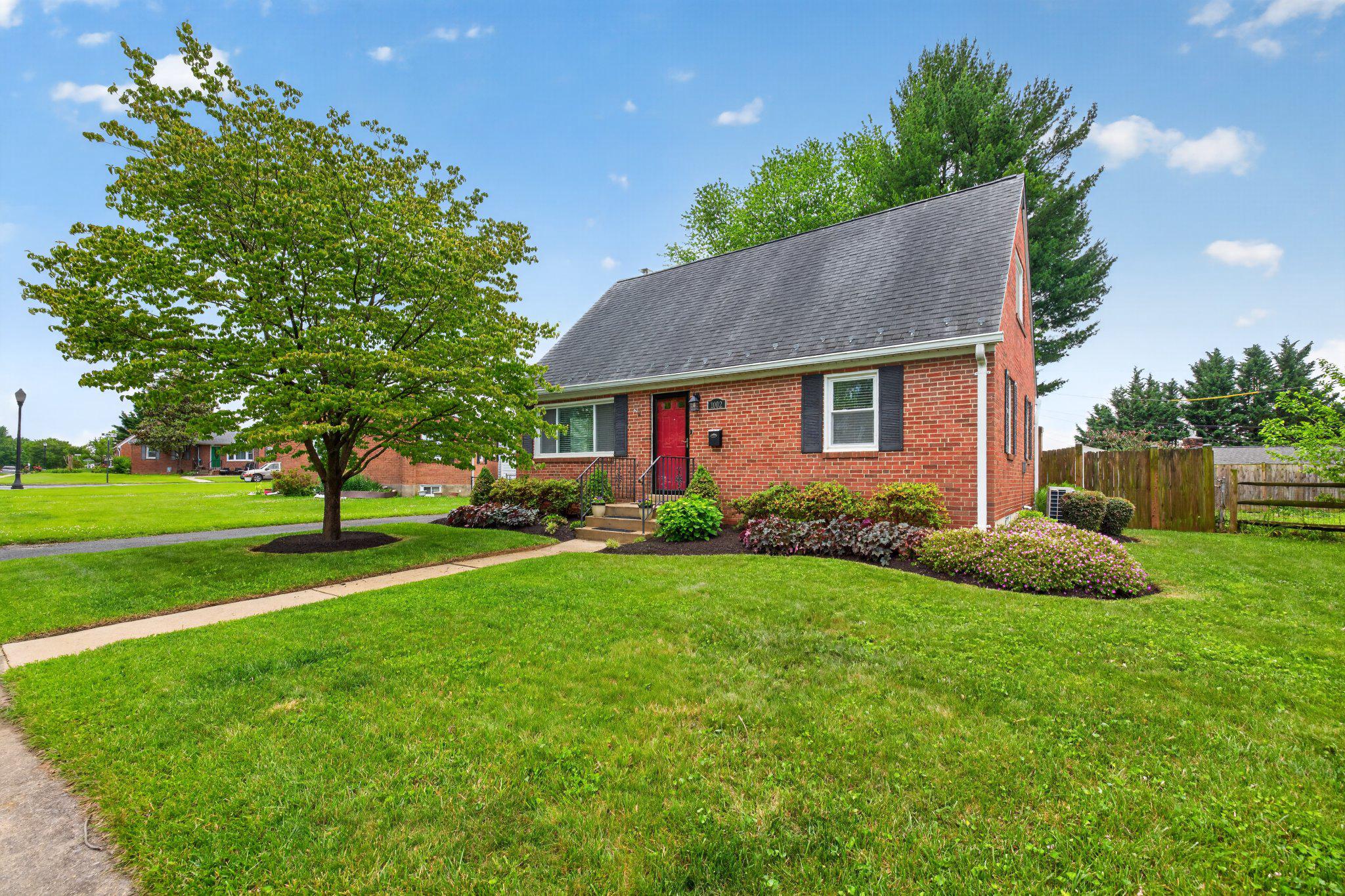 1002 Wilson Place Frederick, MD 21702 - Photo 2 of 30 a front view of a house with a yard