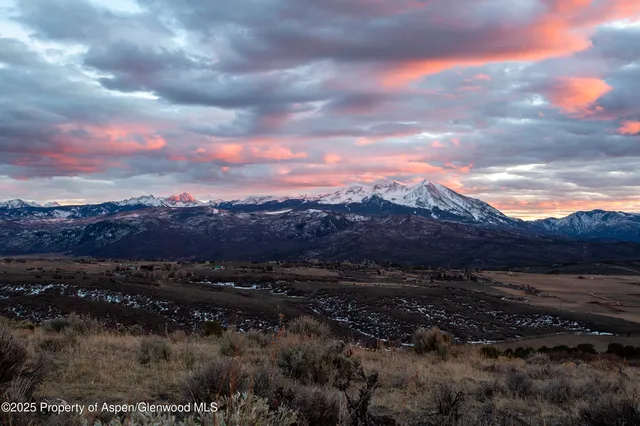 a view of mountains and valleys