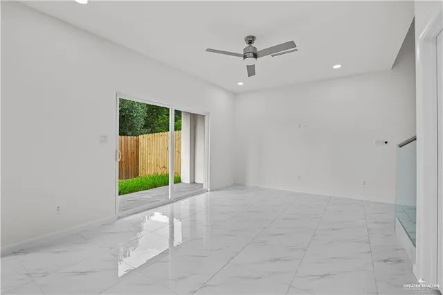 a view of an empty room with a window