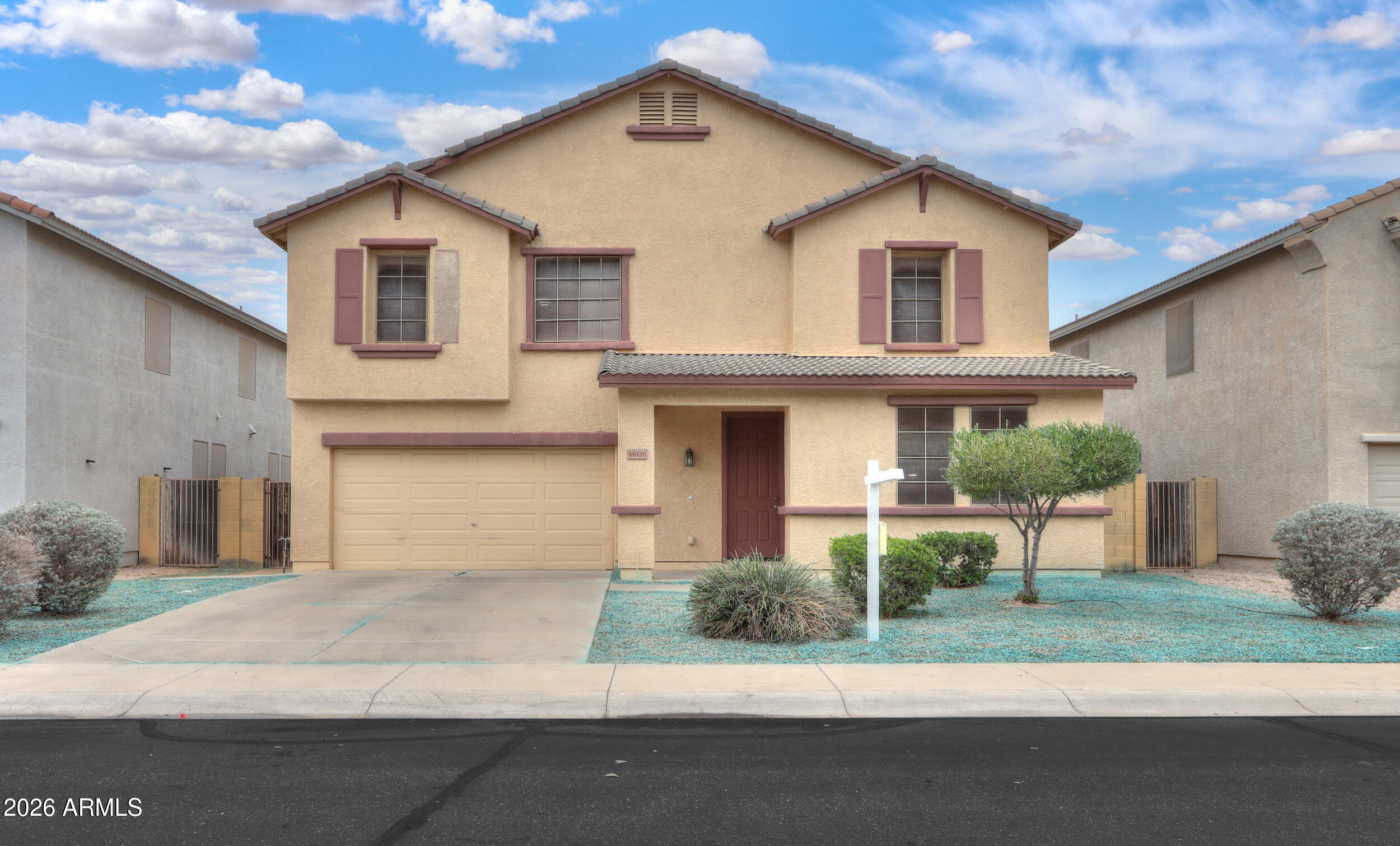 46136 West Sonny Road Maricopa, AZ 85139 - Photo 1 of 81 a view of a white house next to a yard
