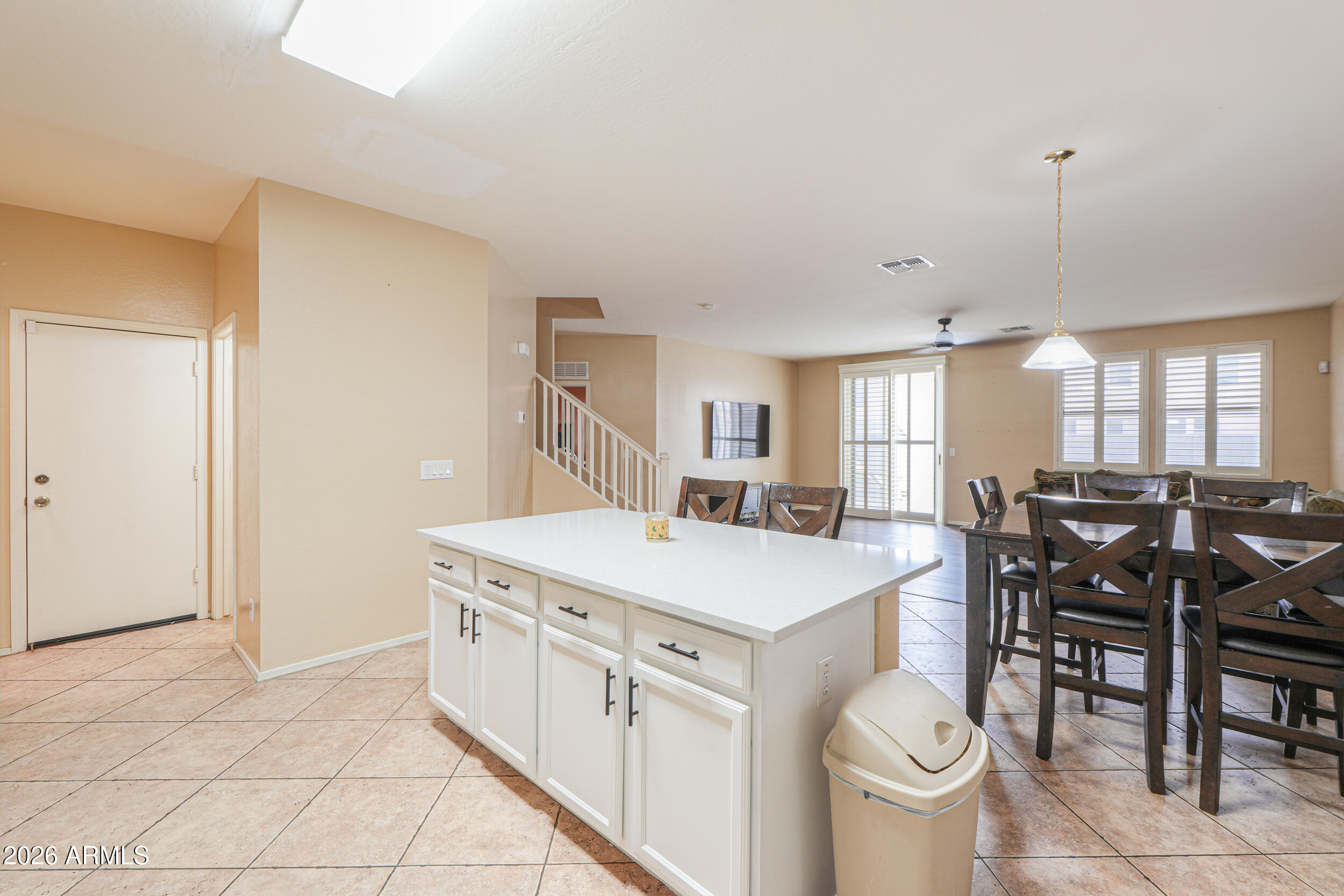 46136 West Sonny Road Maricopa, AZ 85139 - Photo 12 of 81 a large white kitchen with a stove a table and chairs
