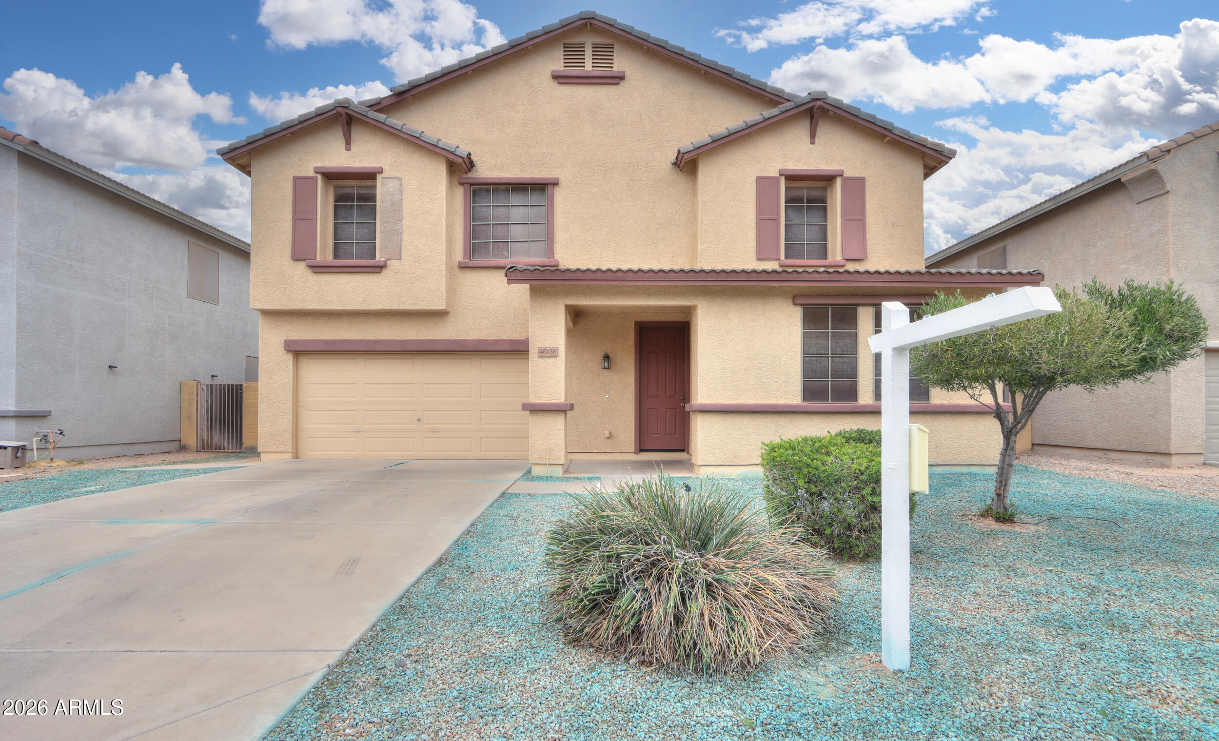 46136 West Sonny Road Maricopa, AZ 85139 - Photo 2 of 81 a front view of a house with a yard