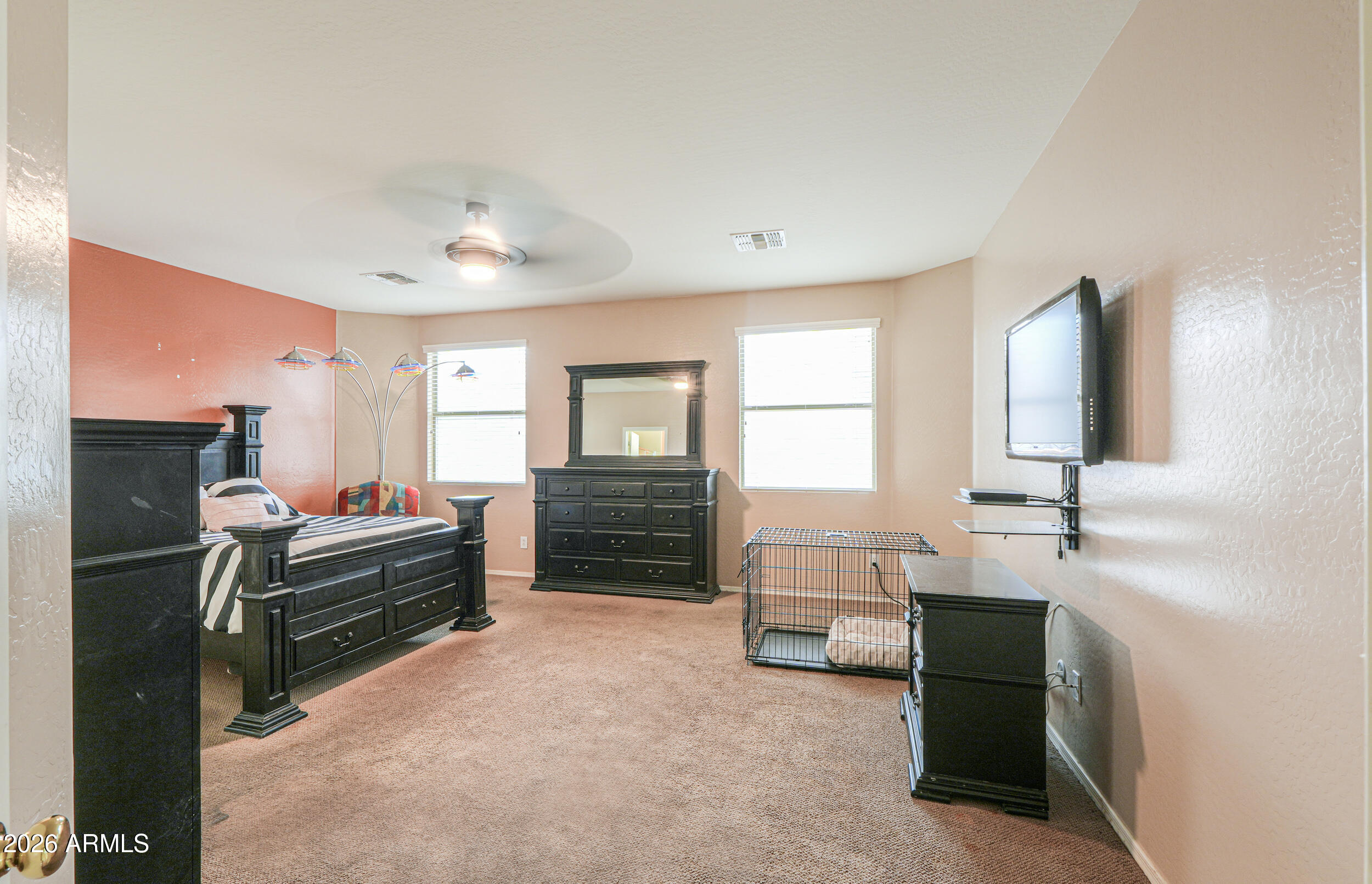 46136 West Sonny Road Maricopa, AZ 85139 - Photo 21 of 81 a bedroom with furniture and a large window
