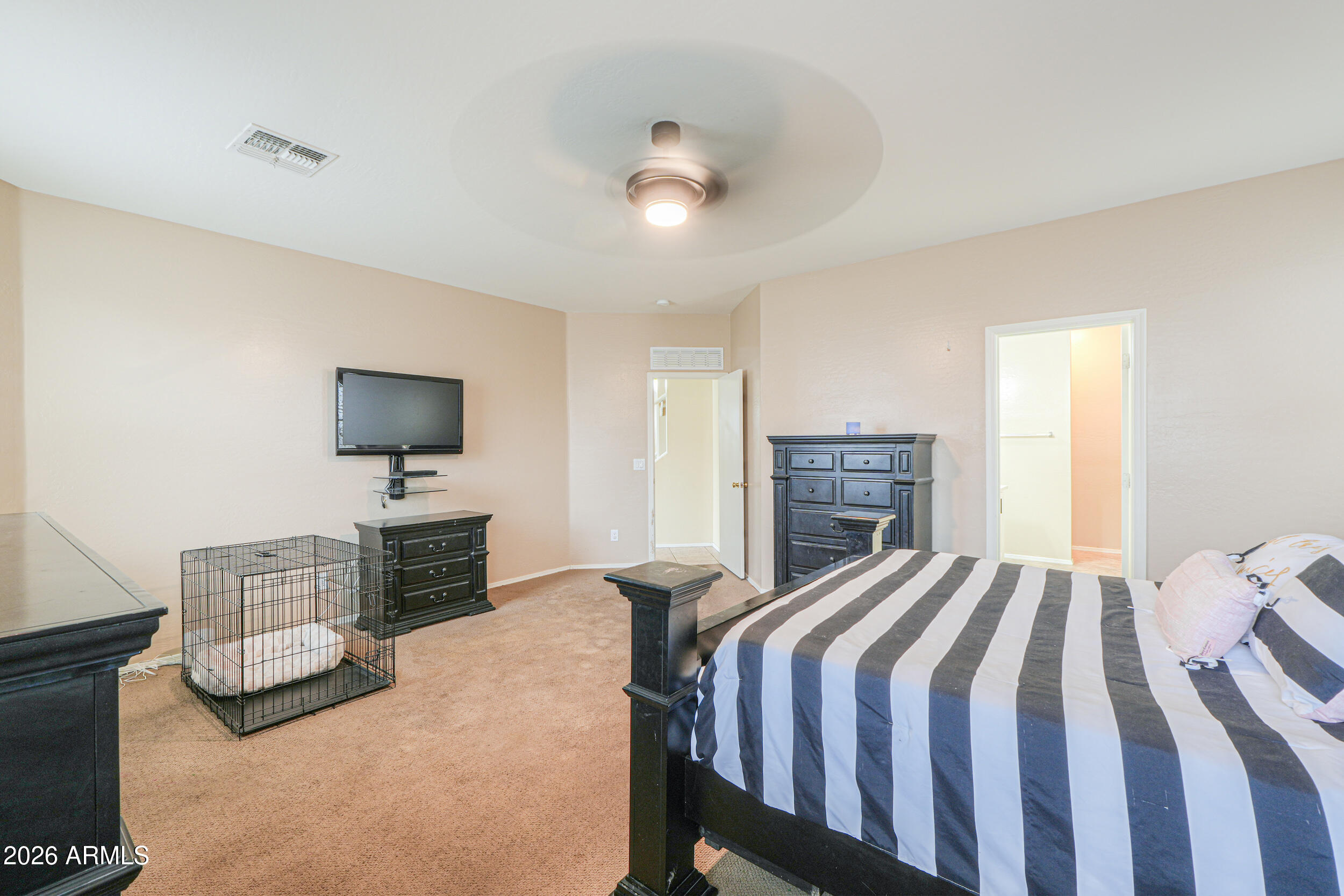 46136 West Sonny Road Maricopa, AZ 85139 - Photo 22 of 81 a bedroom with a bed and a flat screen tv