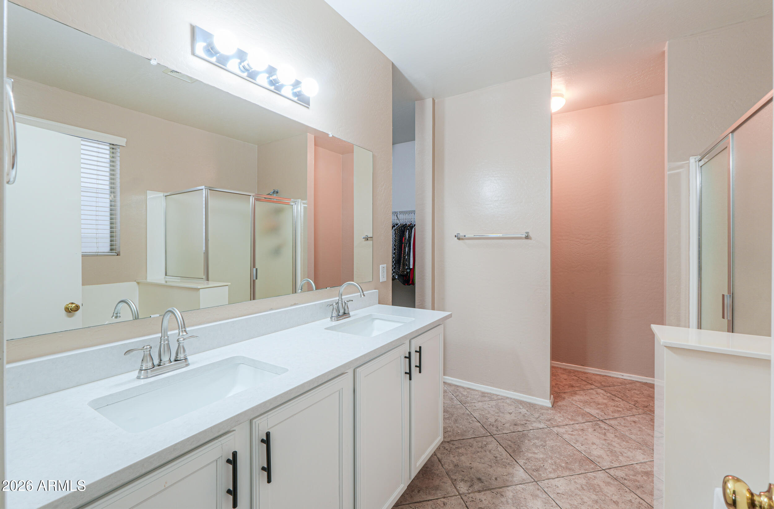 46136 West Sonny Road Maricopa, AZ 85139 - Photo 23 of 81 a bathroom with a sink and a mirror