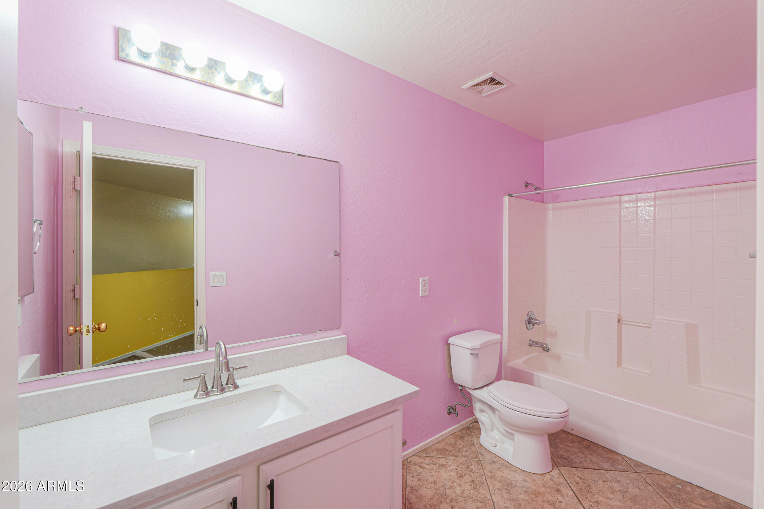 46136 West Sonny Road Maricopa, AZ 85139 - Photo 39 of 81 a bathroom with a sink a toilet a mirror and vanity