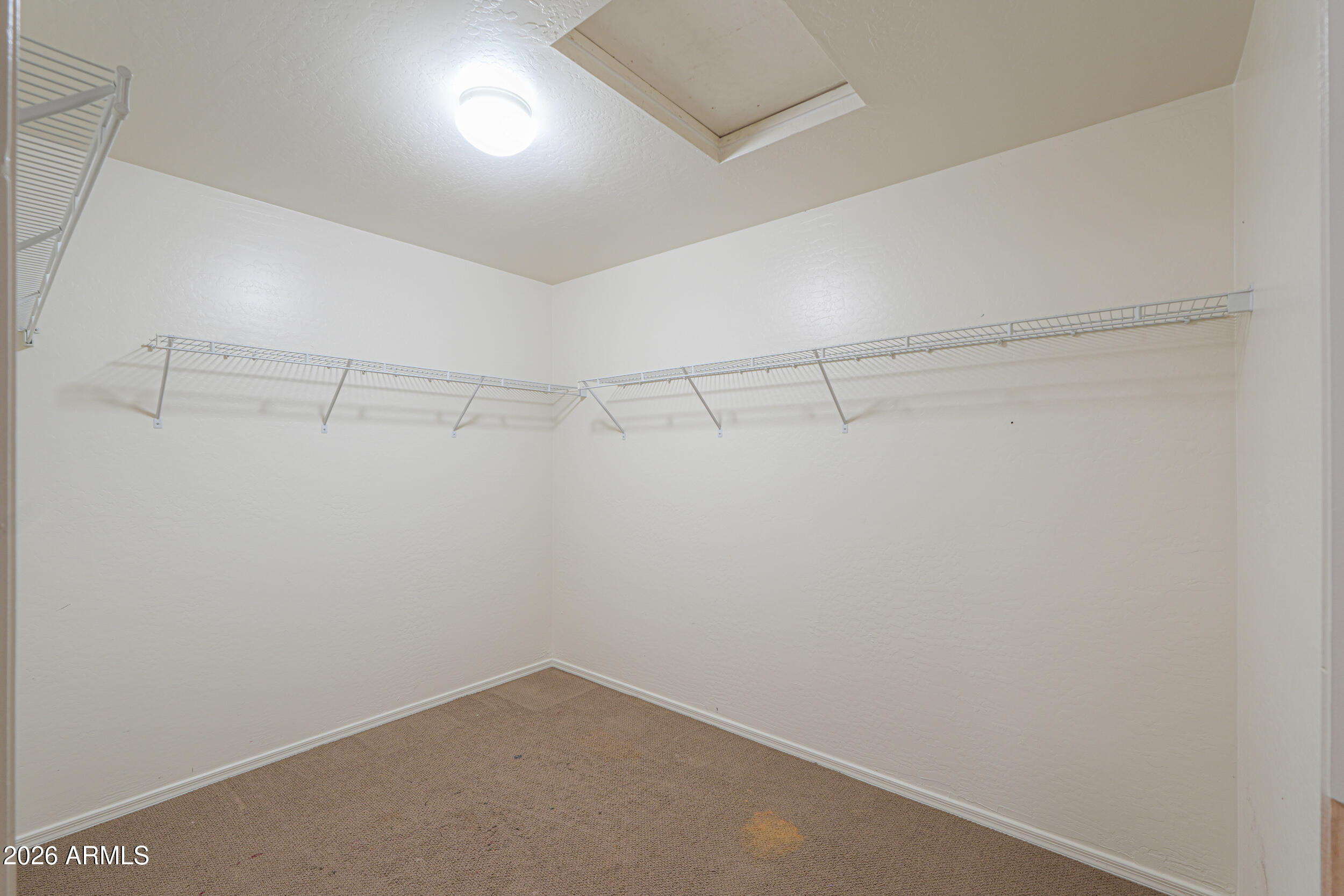 46136 West Sonny Road Maricopa, AZ 85139 - Photo 47 of 81 a view of a room with racks on the wall