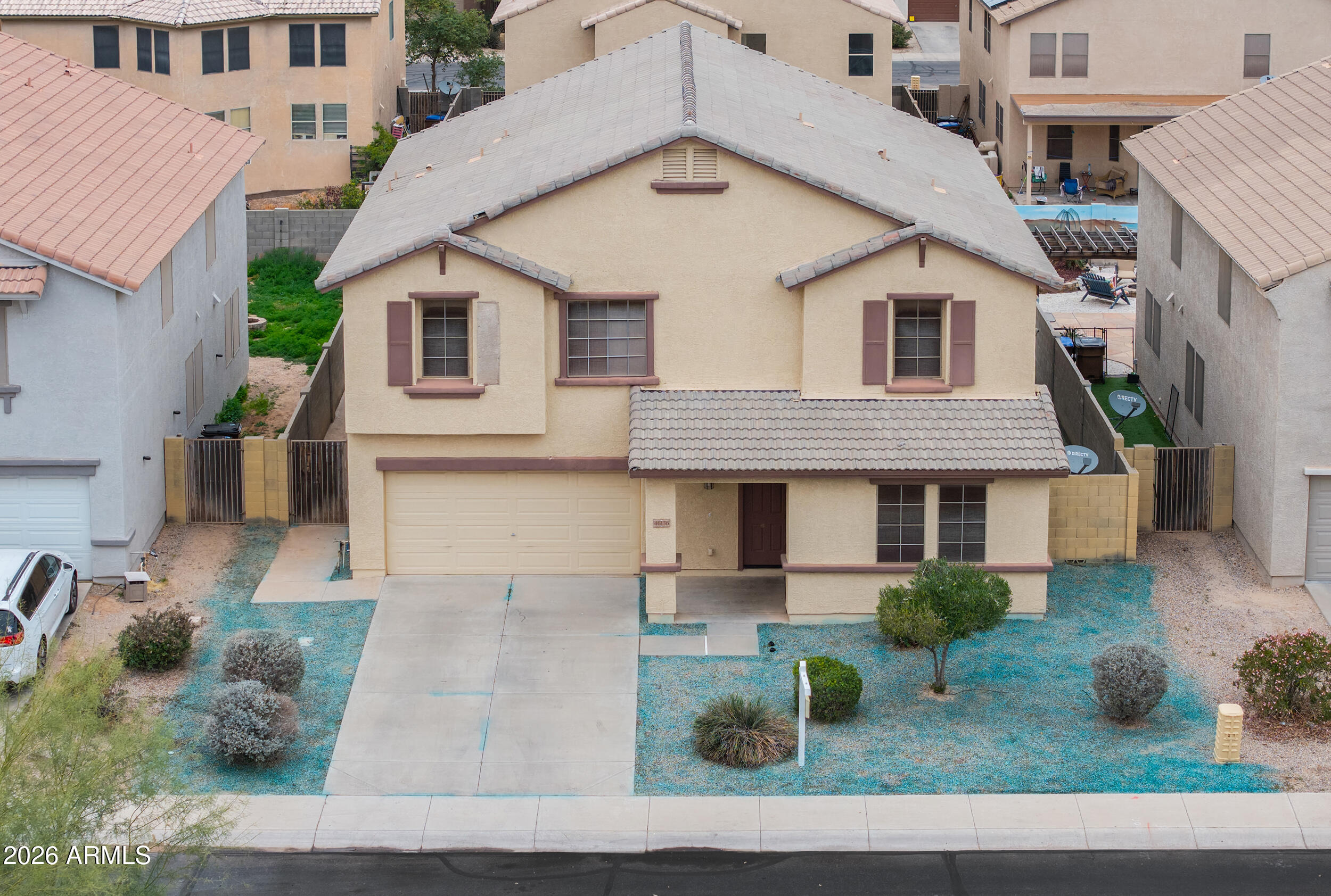 46136 West Sonny Road Maricopa, AZ 85139 - Photo 62 of 81 a view of a white house next to a yard