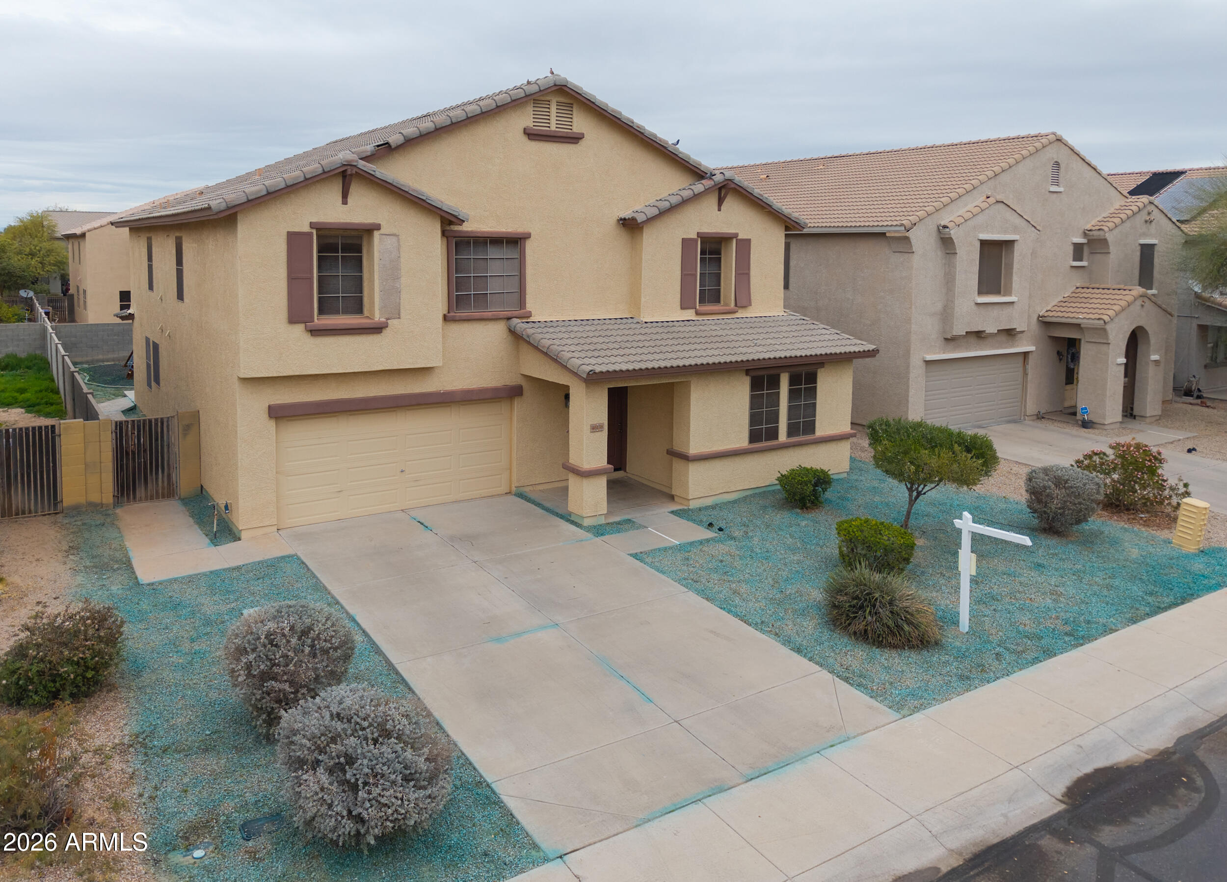 46136 West Sonny Road Maricopa, AZ 85139 - Photo 64 of 81 a front view of a house with garden