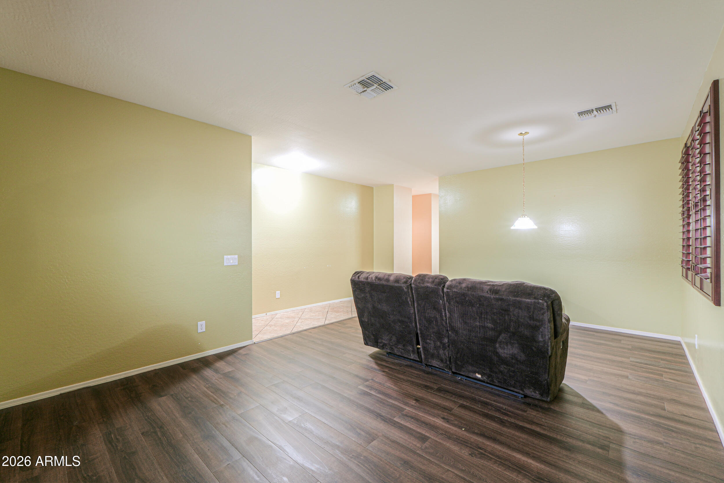 46136 West Sonny Road Maricopa, AZ 85139 - Photo 7 of 81 a living room with couch and a wooden floor