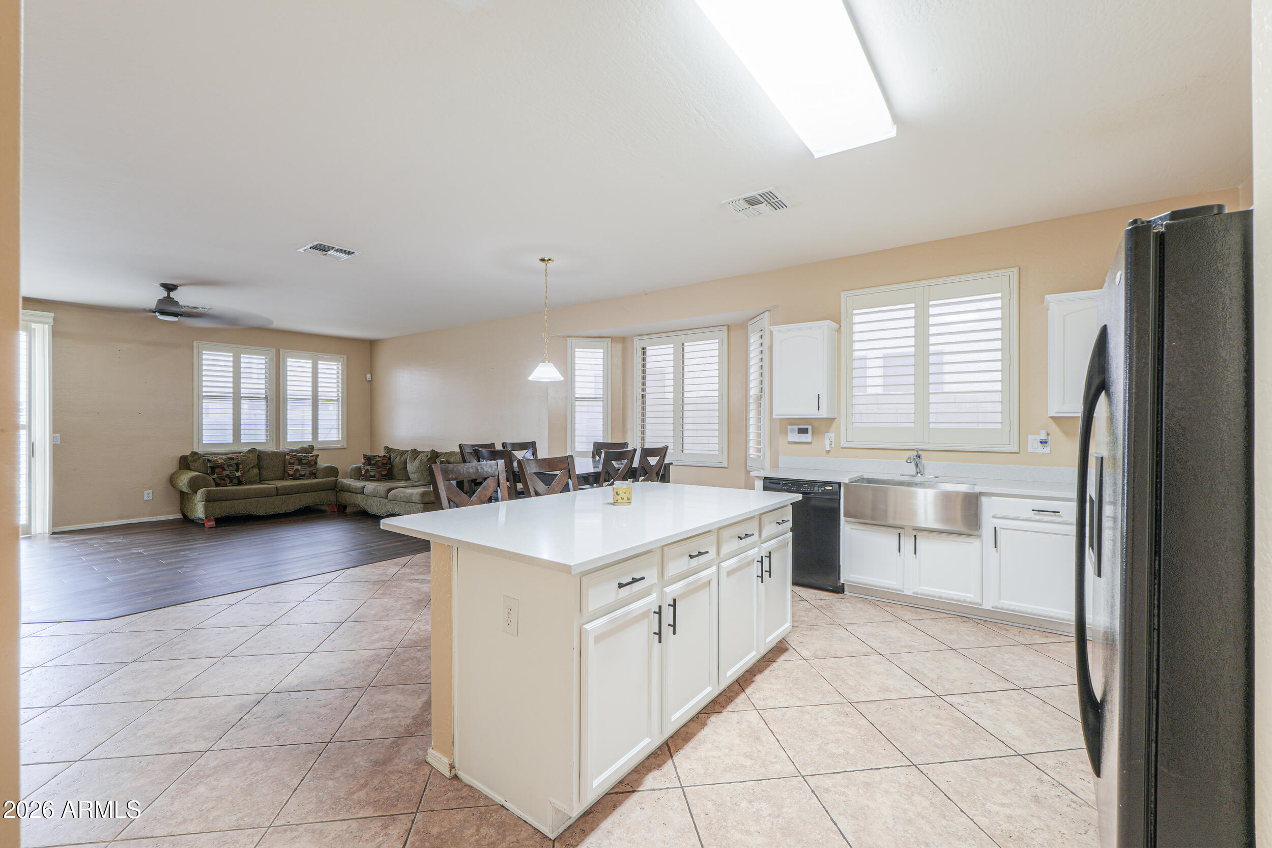 46136 West Sonny Road Maricopa, AZ 85139 - Photo 9 of 81 a kitchen with a sink cabinets and wooden floor