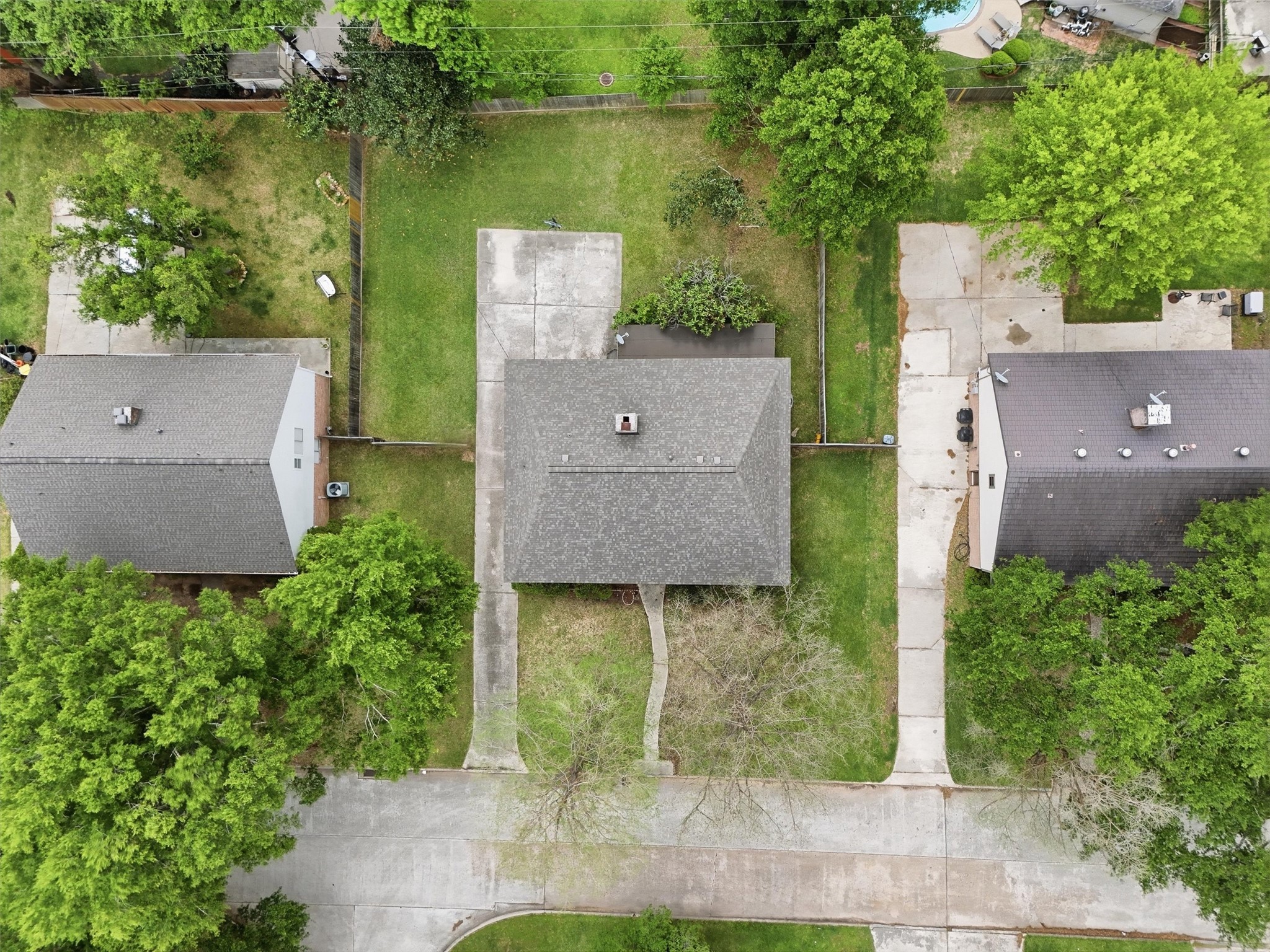 8115 Theisswood Road Spring, TX 77379 - Photo 32 of 36 an aerial view of a house with a yard and a large tree