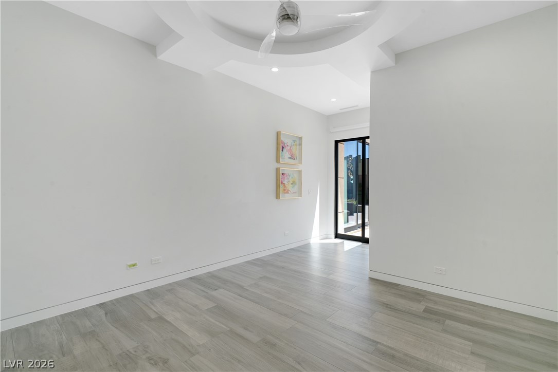 10 Ridge Blossom Road Las Vegas, NV 89135 - Photo 38 of 64 Unfurnished room featuring light wood-style floors, ceiling fan, and recessed lighting