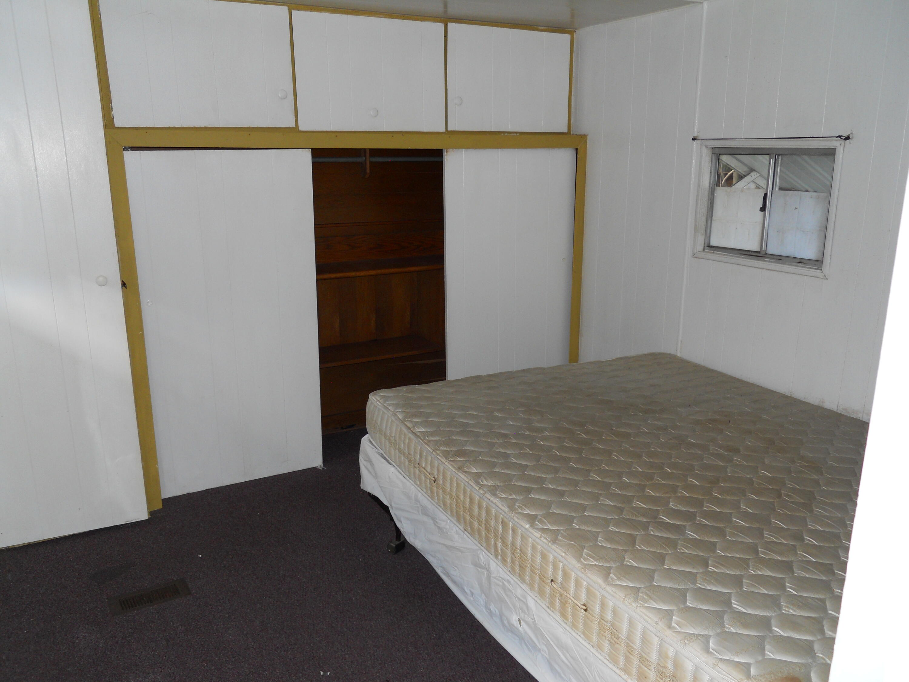 520 Pine Avenue, Unit 5 Goleta, CA 93117 - Photo 5 of 14 a bedroom with a bed and cabinets