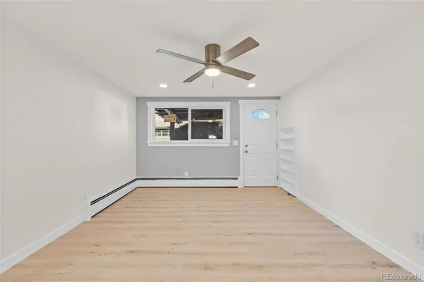 an empty room with a empty space and windows