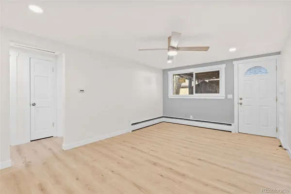 a view of an empty room with a window