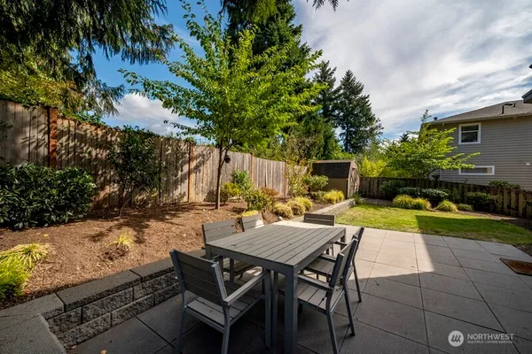 an outdoor space with furniture and garden