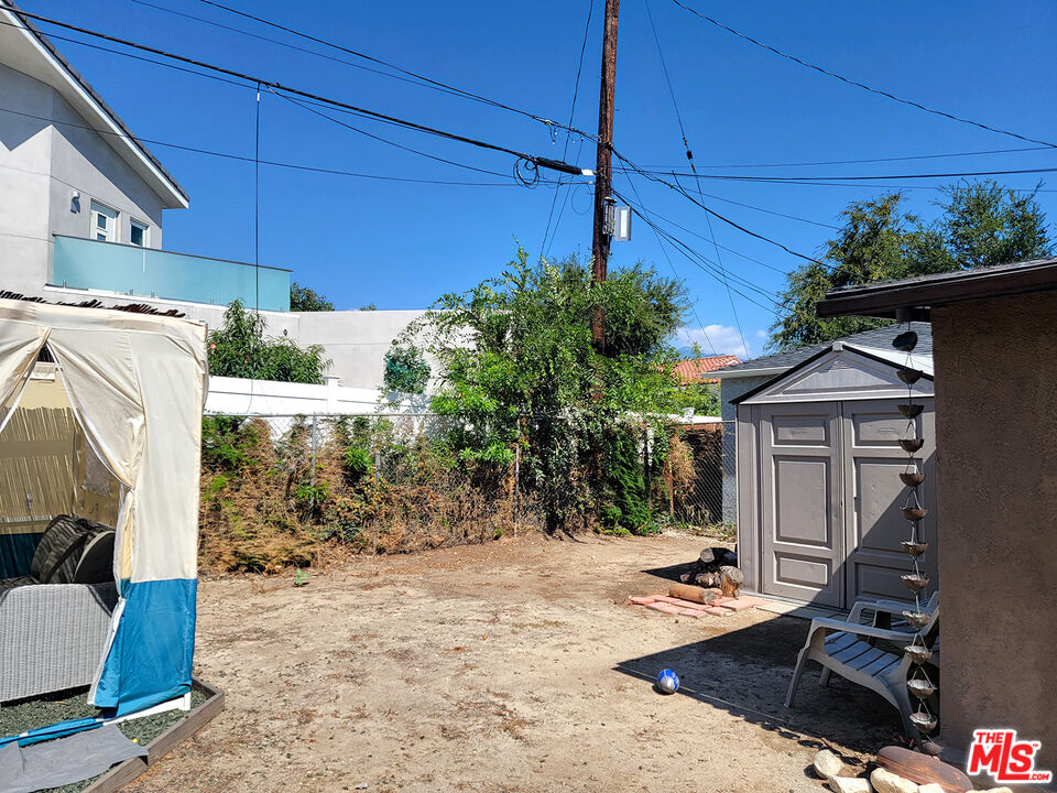 3913 Mohawk Street Pasadena, CA 91107 - Photo 11 of 14 a view of a house with a patio and potted plants