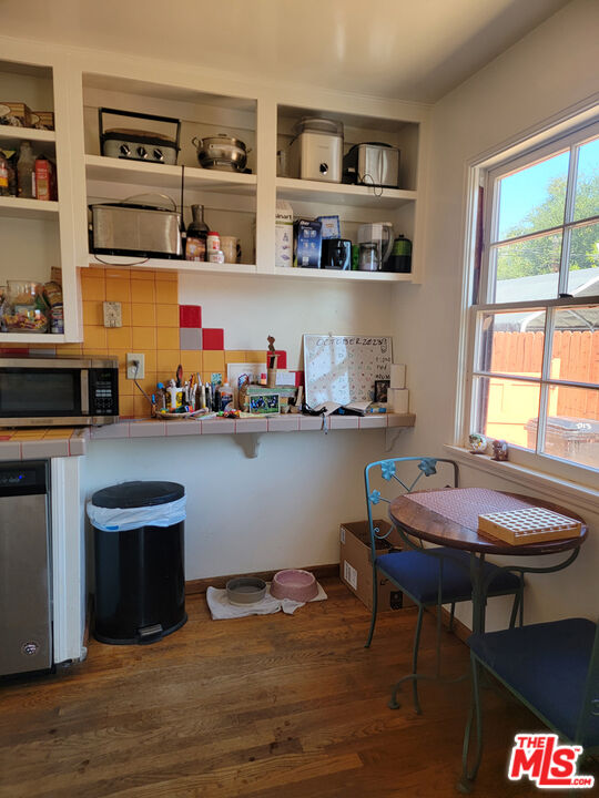 3913 Mohawk Street Pasadena, CA 91107 - Photo 12 of 14 a room with a table chairs workspace and a window