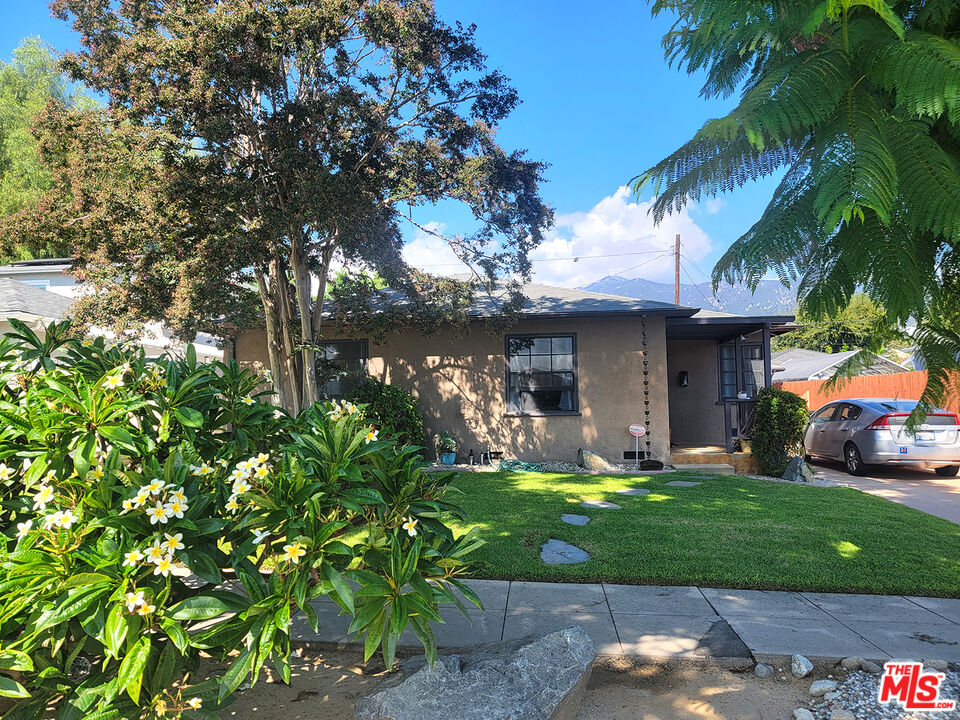 3913 Mohawk Street Pasadena, CA 91107 - Photo 13 of 14 a view of a house with a yard porch and sitting area