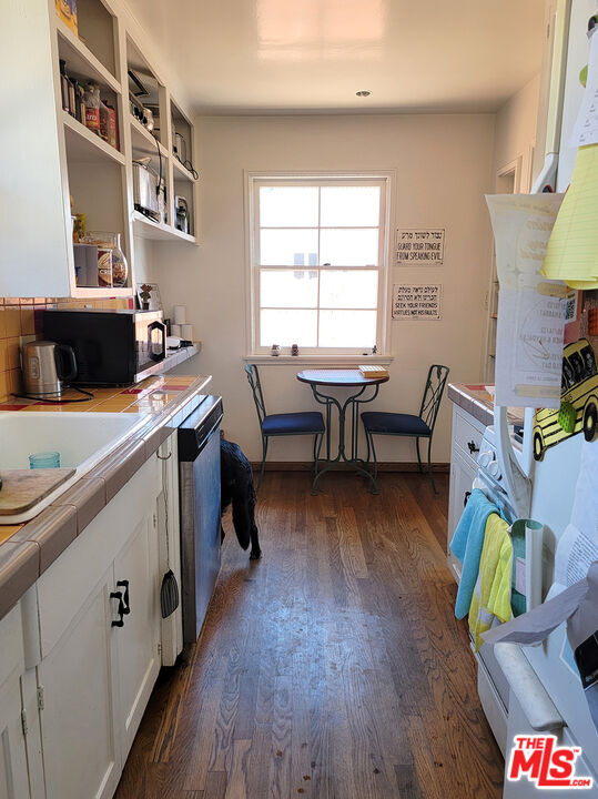 3913 Mohawk Street Pasadena, CA 91107 - Photo 14 of 14 a view of a workspace with furniture and a kitchen
