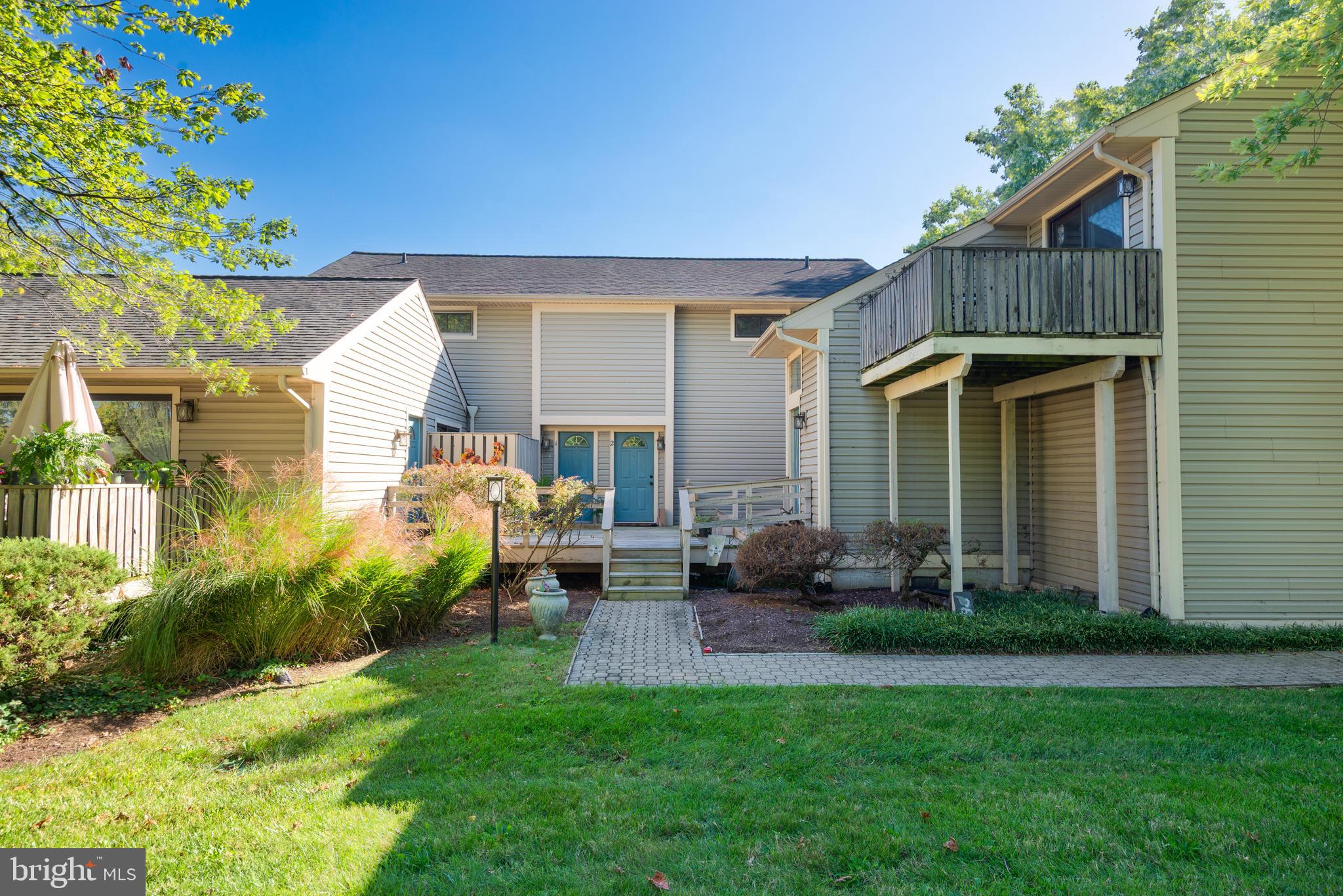 a front view of house with yard and outdoor seating