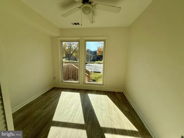 a view of a hallway with a window