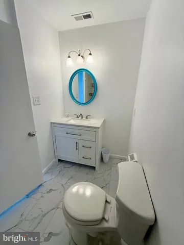 a room with a sink and a mirror