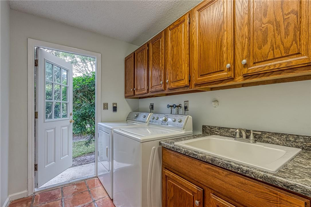 3602 Northwest 24th Avenue Boca Raton, FL 33431 - Photo 51 of 68 Laundry Room with Door into side yard
