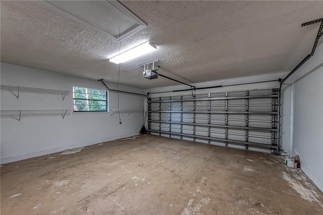 3602 Northwest 24th Avenue Boca Raton, FL 33431 - Photo 52 of 68 Full 2 car garage with shelving