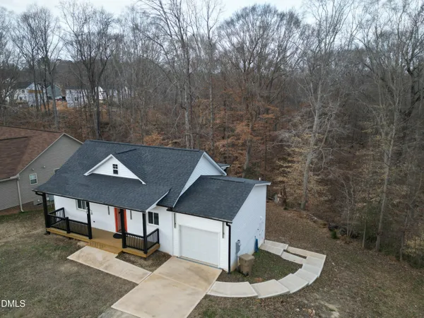 a aerial view of a house with a yard