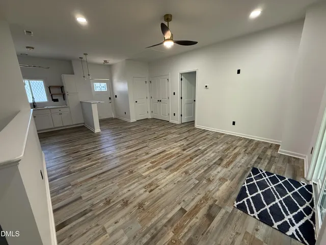 a kitchen with stainless steel appliances granite countertop a refrigerator a sink and a stove