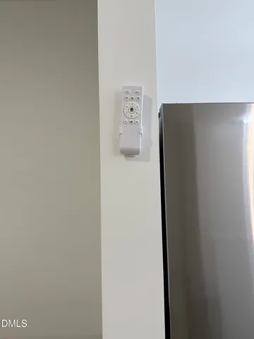 a view of a dry yard with wooden fence